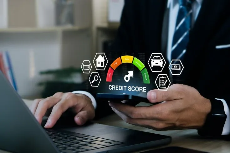 Person reviewing household budget documents and calculating expenses